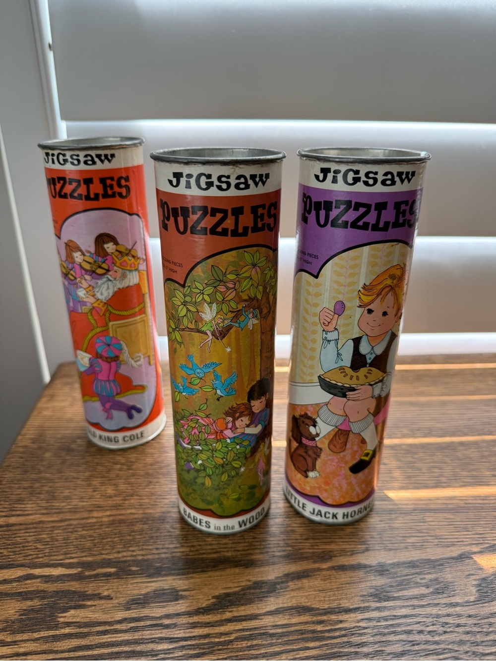 Vintage (1970s) jigsaw puzzles in canisters